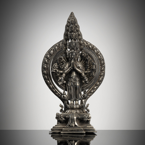 <b>A fine silver figure of Ekadasha-Lokeshvara on a throne</b>