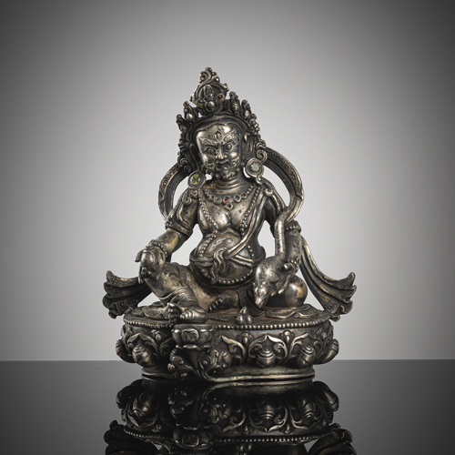 <b>A fine silver figure of Vaishravana on a lotus</b>