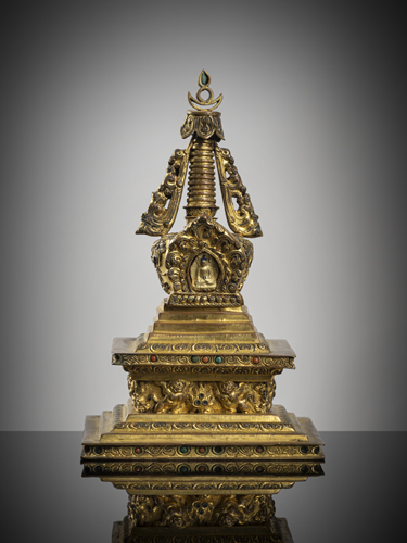 <b>A fine gilt-copper stupa with stone trim</b>