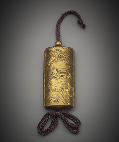 <b>A five-piece inro with gold lacquer decoration of a dragon above waves with ojime and netsuke</b>