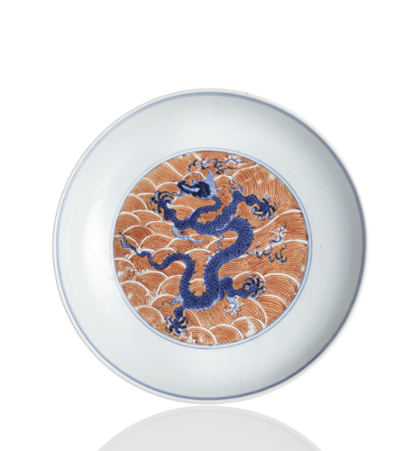 <b>A rare iron-red and blue and white  dragon dish</b>