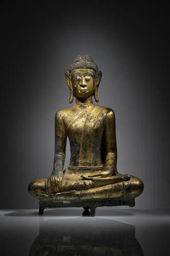 <b>A GILT- AND BLACK-LACQUERED BRONZE FIGURE OF BUDDHA SHAKYAMUNI</b>