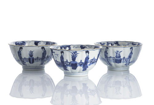 <b>Three underglaze blue porcelain bowls with deep matching ribbed decoration of ladies in the garden</b>
