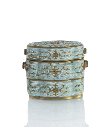 <b>A porcelain box and cover in the shape of a Japanese inro with relief decoration and flower tendrils in gold and turquoise</b>