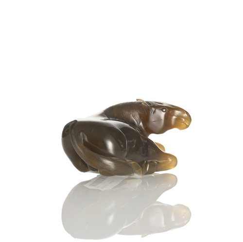 <b>A beautiful sculpture of a reclining horse made of beige-grey, partly striped agate</b>