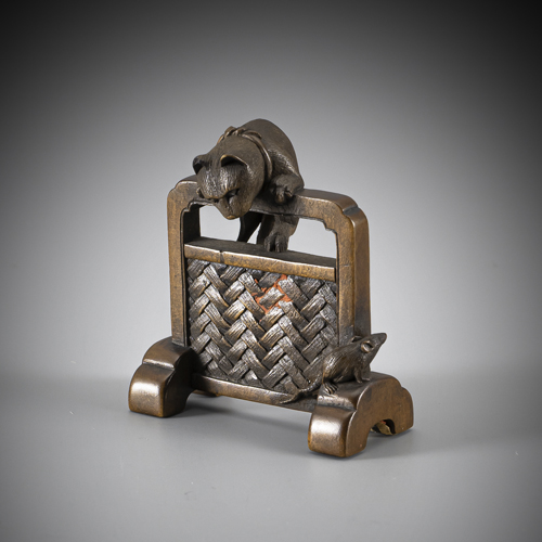 <b>A fine netsuke of a cat on a screen 'tsuitate' hunting for a mouse made of brown wood</b>