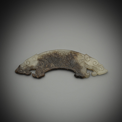 <b>A MINIATURE JADE CARVING 'HUANG' WITH TWO TIGER HEADS</b>
