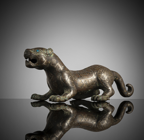 <b>A very rare bronze of a silver-inlaid tiger</b>