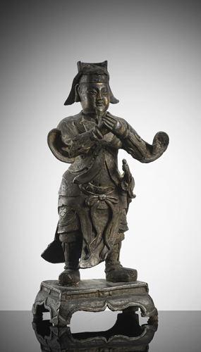 <b>A part-gilt bronze of a standing adorant</b>