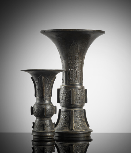 <b>Two gu-shaped bronze vases in archaic style with beautiful age patina</b>