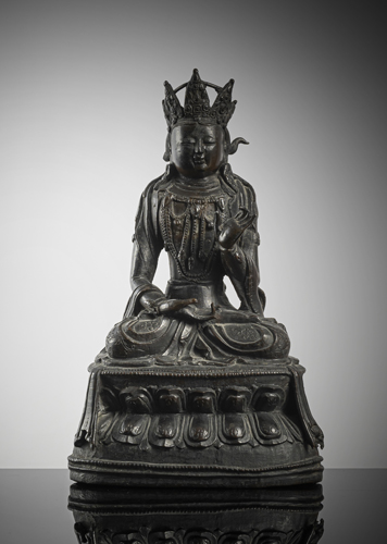 <b>A bronze of a bodhisattva  on a lotus throne</b>