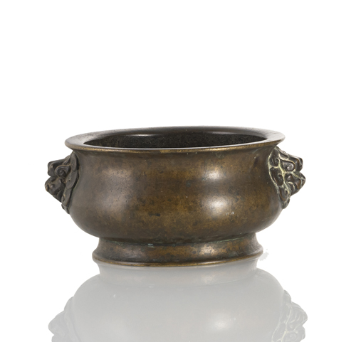 <b>A bronze incense burner with lion mask handles</b>