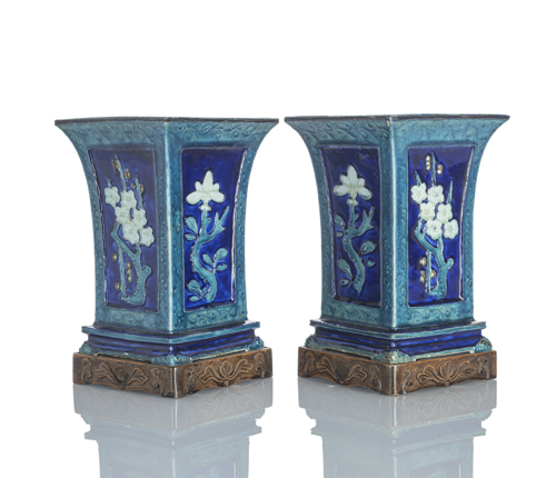 <b>Pair of square porcelain vases in the Fahua style with floral reserves in relief</b>