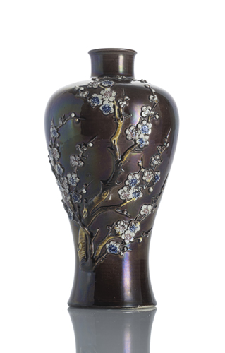 <b>A Meiping vase in the Fahua style with a modelled flowering branch on an aubergine-coloured background</b>