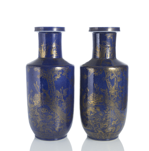<b>A pair of powder blue porcelain rouleau vases with fine gold painting of phoenixes, flowers, herons and birds</b>