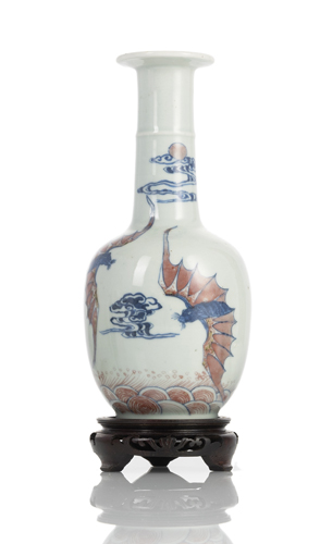 <b>A porcelain vase with copper-red and underglaze blue decoration of bats among clouds</b>