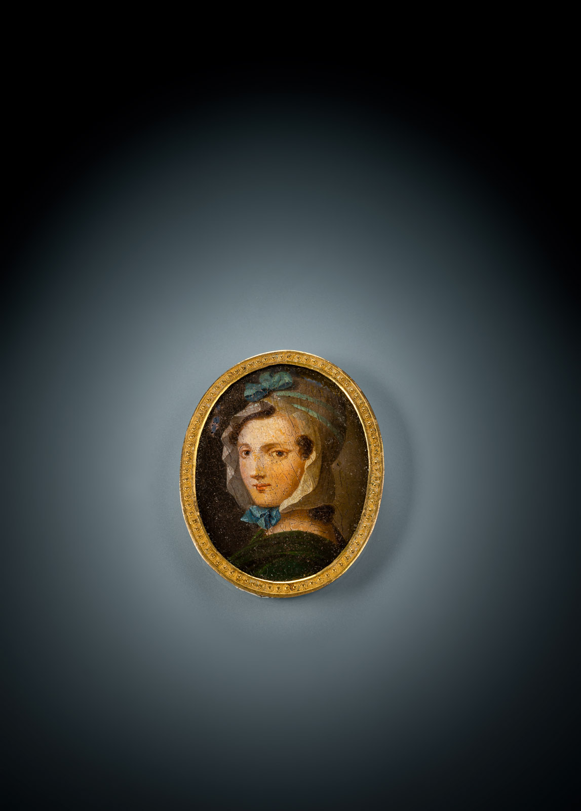 <b>A MINIATURE PORTAIT OF A LADY WITH WHITE CAP</b>