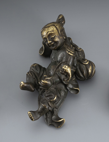 <b>Bronze paper weight in the shape of reclining Liu Hai with his three-legged toad</b>