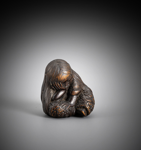 <b>A netsuke of sleeping Shojo</b>