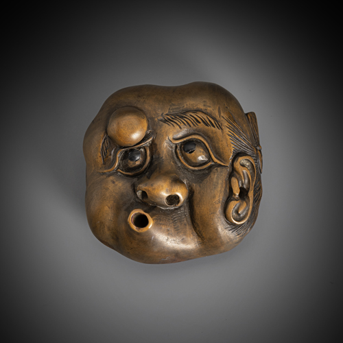 <b>Hyottoko netsuke made of wood, worked on both sides</b>