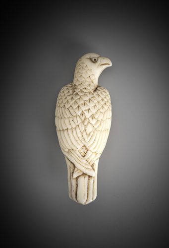 <b>An unusual netsuke of a bird of prey made from maritime ivory</b>