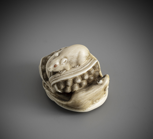 <b>A carved ivory netsuke of a rat on sorghum</b>