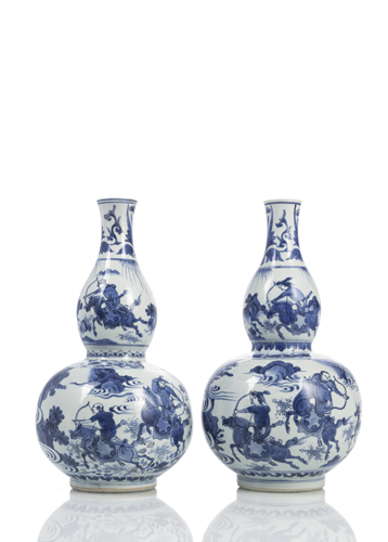 <b>A rare pair of gourd-shaped porcelain vases with underglaze blue decoration of roman scenes</b>