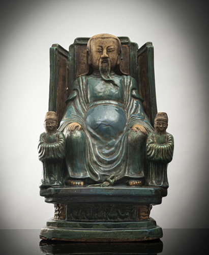 <b>A large green-glazed Shiwan ware figure of Zhenwu with two attendants</b>