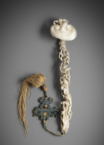 <b>A fine carved Fine Ruyi sceptre made of light grey and white jade with green and black tones</b>