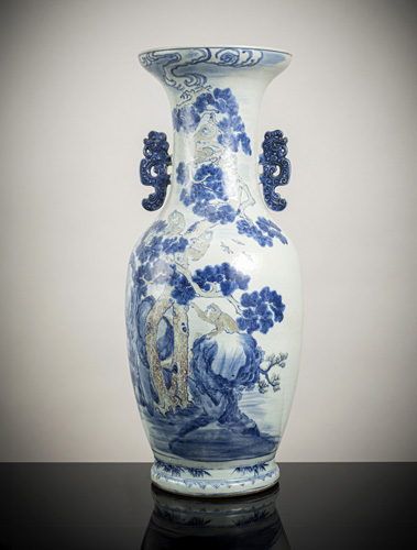 <b>A blue and white and copper-red monkeys and pine trees porcelain floor vase with 'chilong' handles</b>