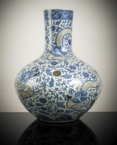 <b>A large cobalt-blue and copper-red porcelain vase with dragons among lotus blossoms and scrolls, 'tianqiuping'</b>