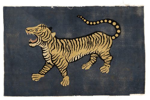 <b>A blue-ground tiger rug</b> <b>A blue-ground tiger rug</b>