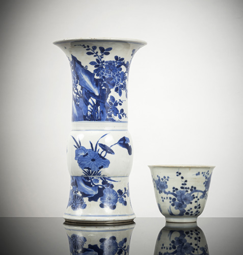 <b>An underglaze blue 'Gu'-shaped porcelain vase with floral decoration and a mug with 'Three Friends' decoration</b>