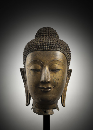 <b>A GILT-BRONZE HEAD OF BUDDHA SHAKYAMUNI</b>