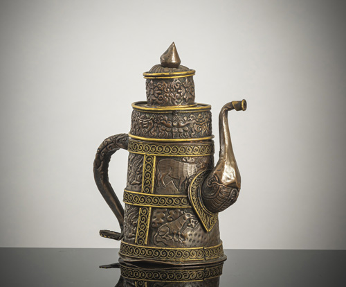 <b>A copper repoussé ewer and cover with bronze fittings</b>