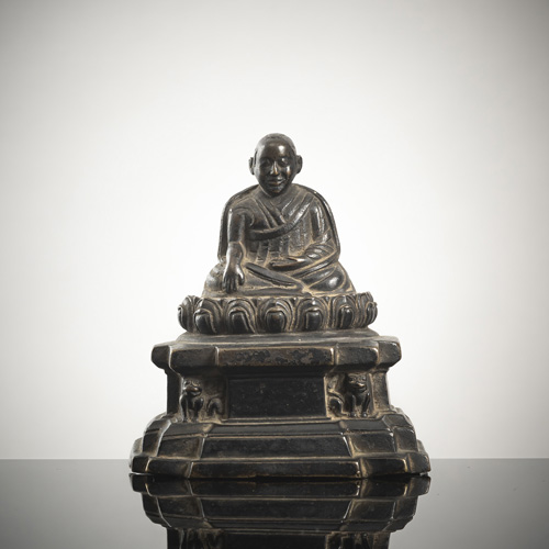 <b>A BRONZE FIGURE OF A LAMA</b>