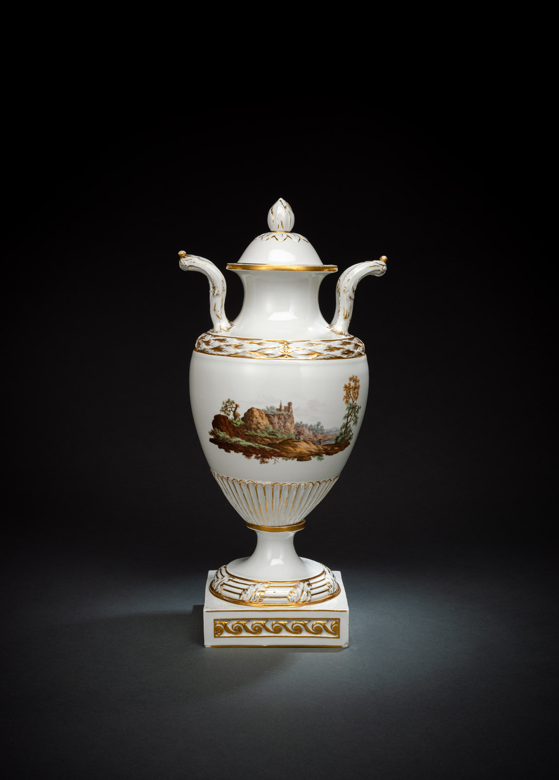 <b>A BALUSTER SHAPED LANDSCAPE PATTERN AND GILT VASE AND COVER</b>