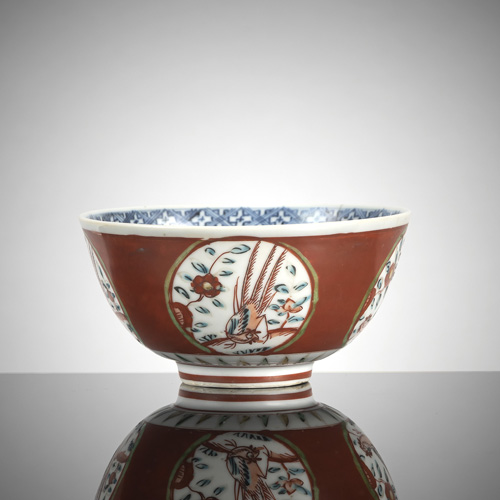 <b>A small iron-red-ground 'kinrande' porcelain bowl</b> <b>A small iron-red-ground 'kinrande' porcelain bowl</b>