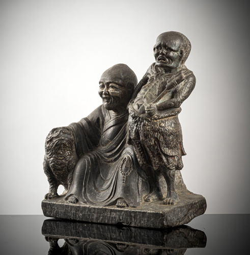 <b>A STONE GROUP OF DHARMATALA  AND TIGER NEAR AN  ATTENDANT</b>