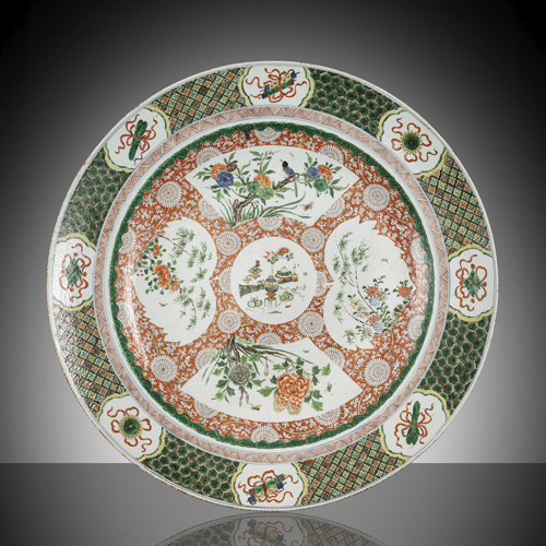 <b>A large porcelain charger with floral decoration in the colours of the 'famille verte'</b> <b>A large porcelain charger with floral decoration in the colours of the 'famille verte'</b>