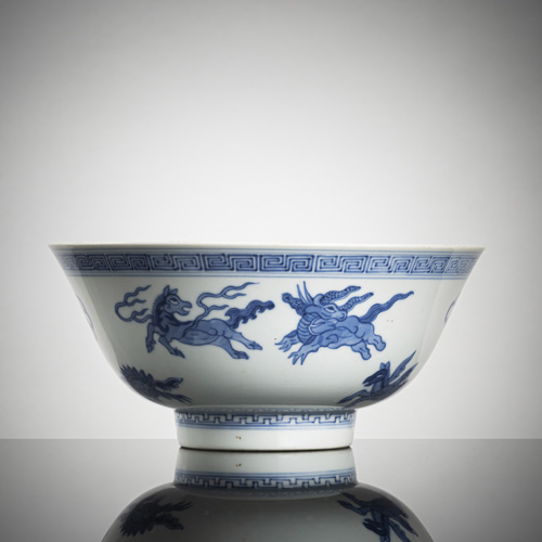 <b>Underglaze blue porcelain round bowl with marine mythical creatures around the wall and a winged dragon on the inside of the base</b>
