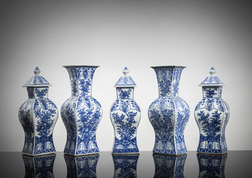 <b>A five-piece set with three vases and covers and two porcelain vases with underglaze blue decoration of flowers and foliage</b>