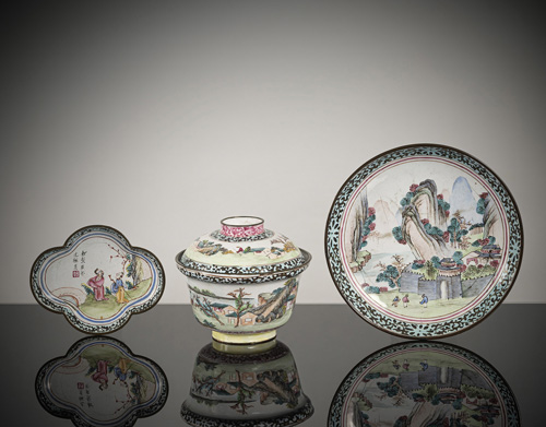 <b>A lidded bowl and two saucers with Canton enamel decoration</b>
