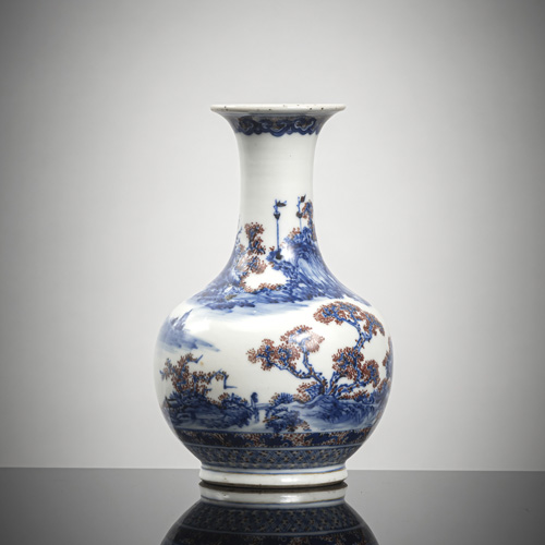 <b>A small bottle vase with landscape decoration in copper red and underglaze blue</b>