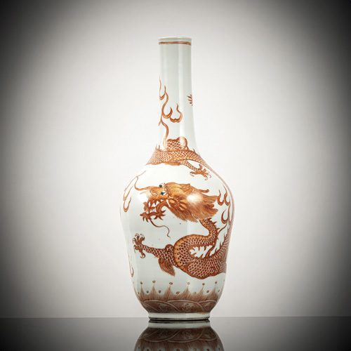 <b>A porcelain bottle vase with iron-red dragon decoration above waves</b> <b>A porcelain bottle vase with iron-red dragon decoration above waves</b>
