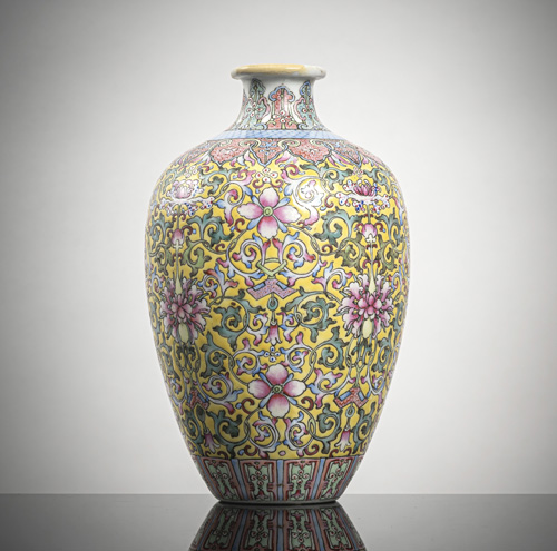 <b>A 'Famille rose' porcelain vase with floral decoration on a yellow gound</b> <b>A 'Famille rose' porcelain vase with floral decoration on a yellow gound</b>