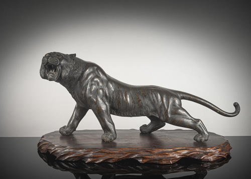 <b>A large bronze model of a tiger</b>