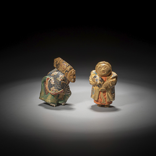 <b>Two light beige carved wood netsuke, painted, partly with gold</b>