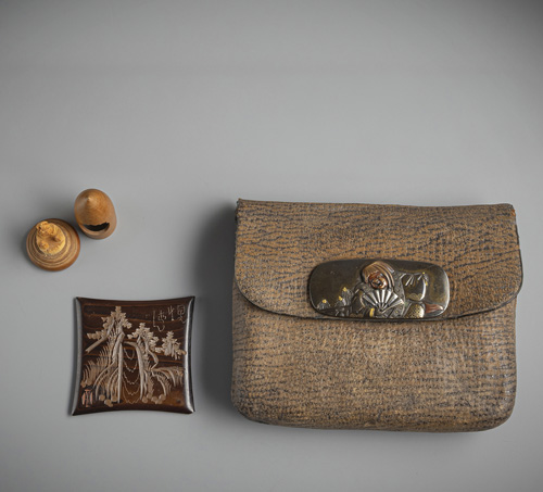 <b>A leather tobacco pouch with fine kanemono and wooden pipe case</b>