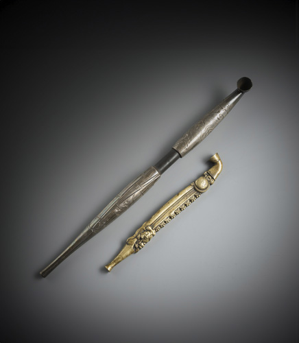 <b>Two pipes:  Wood and silver, engraving of a tiger and dragon next to bamboo and clouds; metal with dragon and tiger in relief</b>